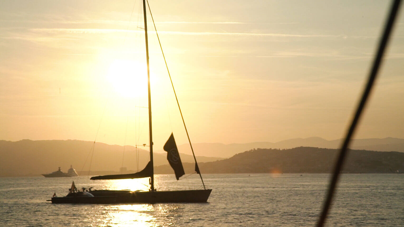 Still of a yacht at sunset from an event videos example for Wall Street Journal