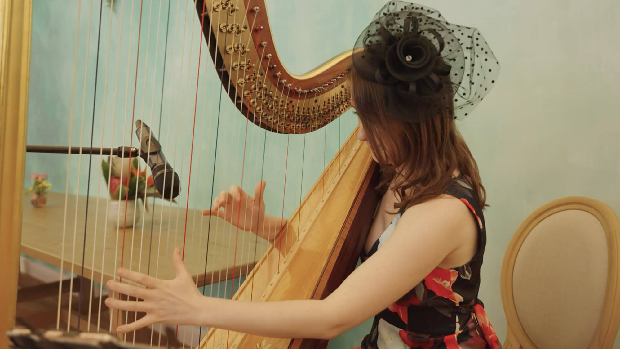A harp player performing at a Moet & Chandon Race Day event, filmed by Rise Media