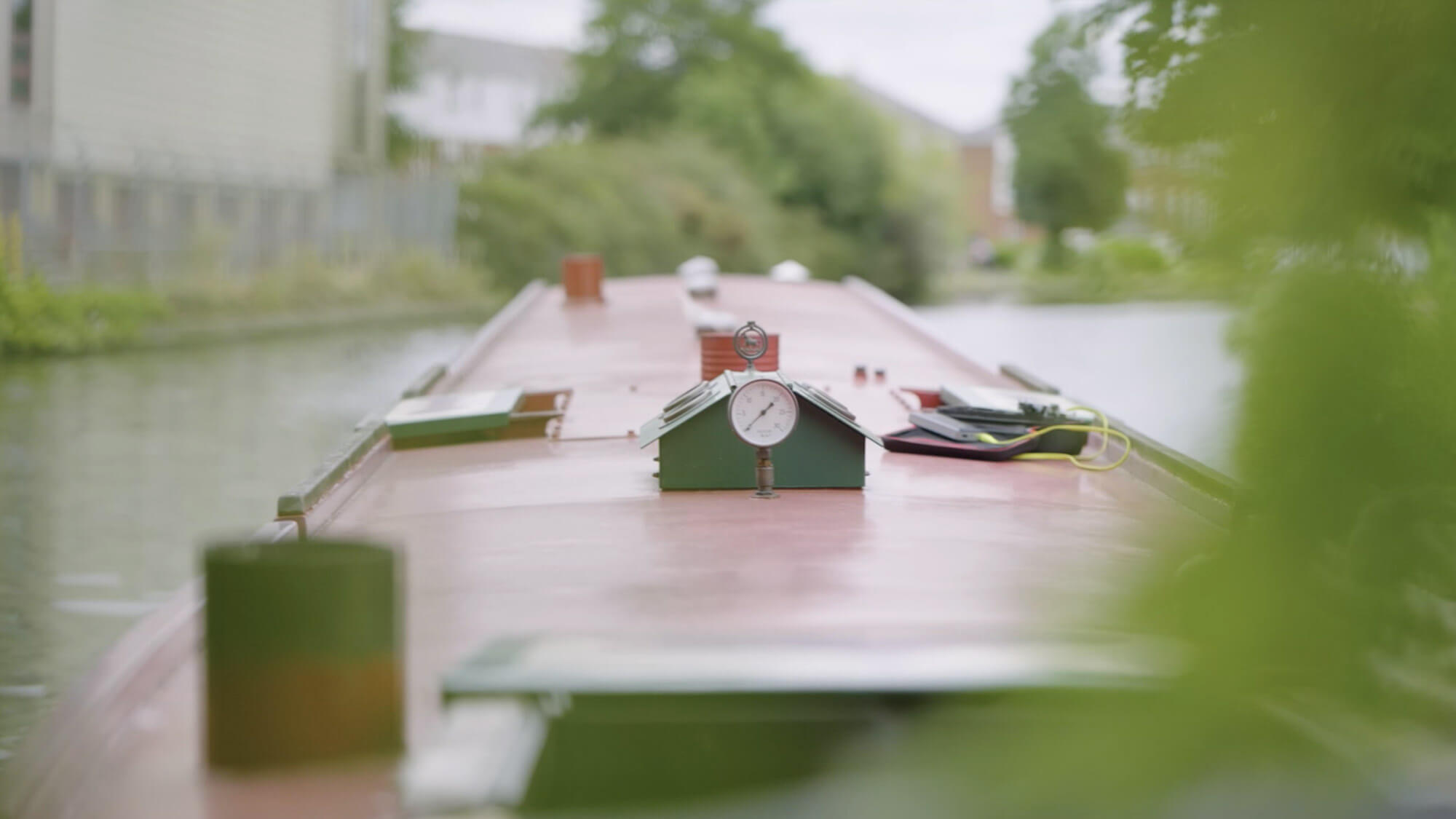 Close up of the top of a narrowboat on a canal