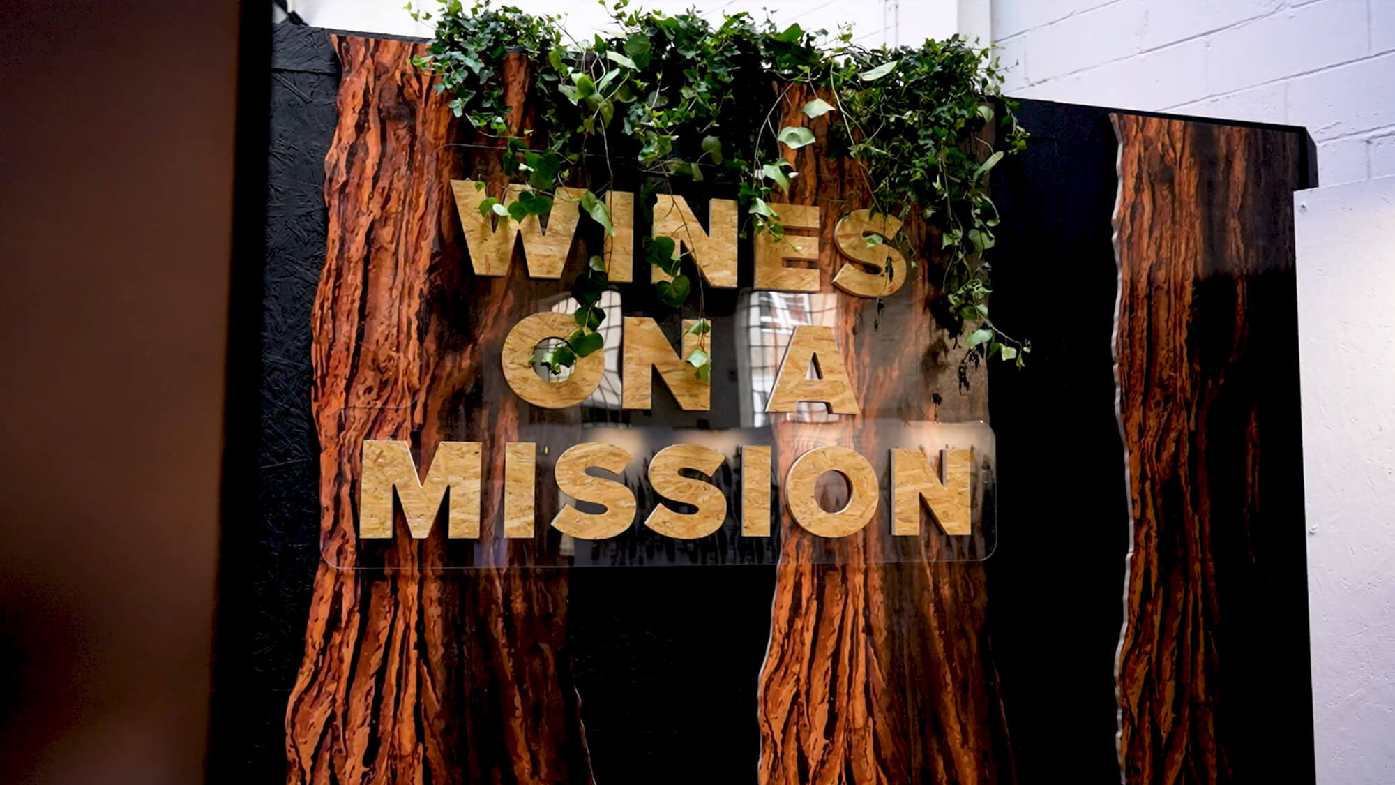 A wall sign reading 'Wines On A Mission'