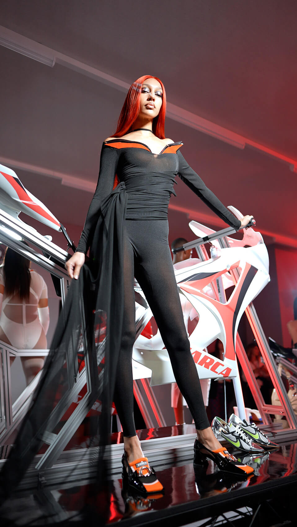 A female model posing in a TikTok London Fashion Week live streaming shot