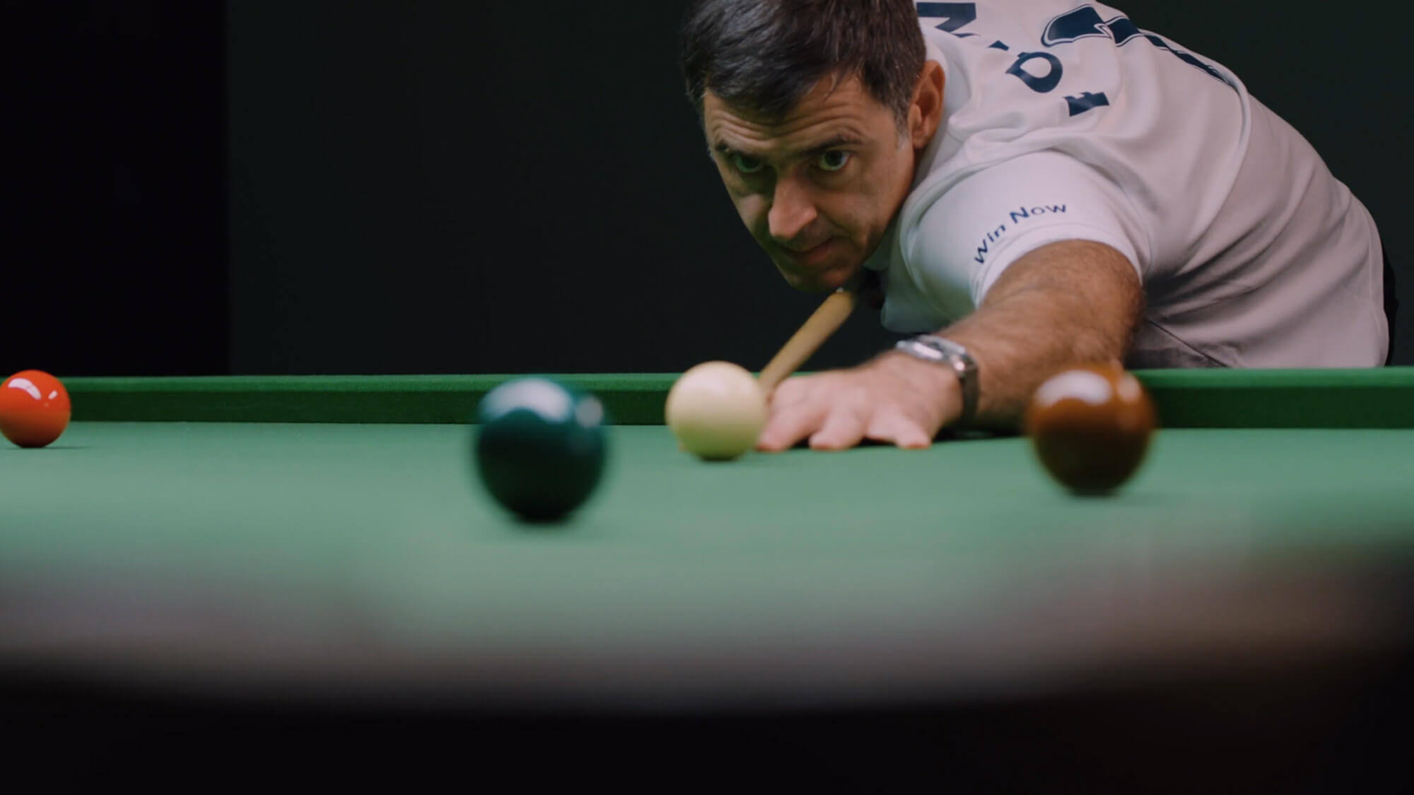 Close up of Ronnie O'Sullivan taking a snooker shot