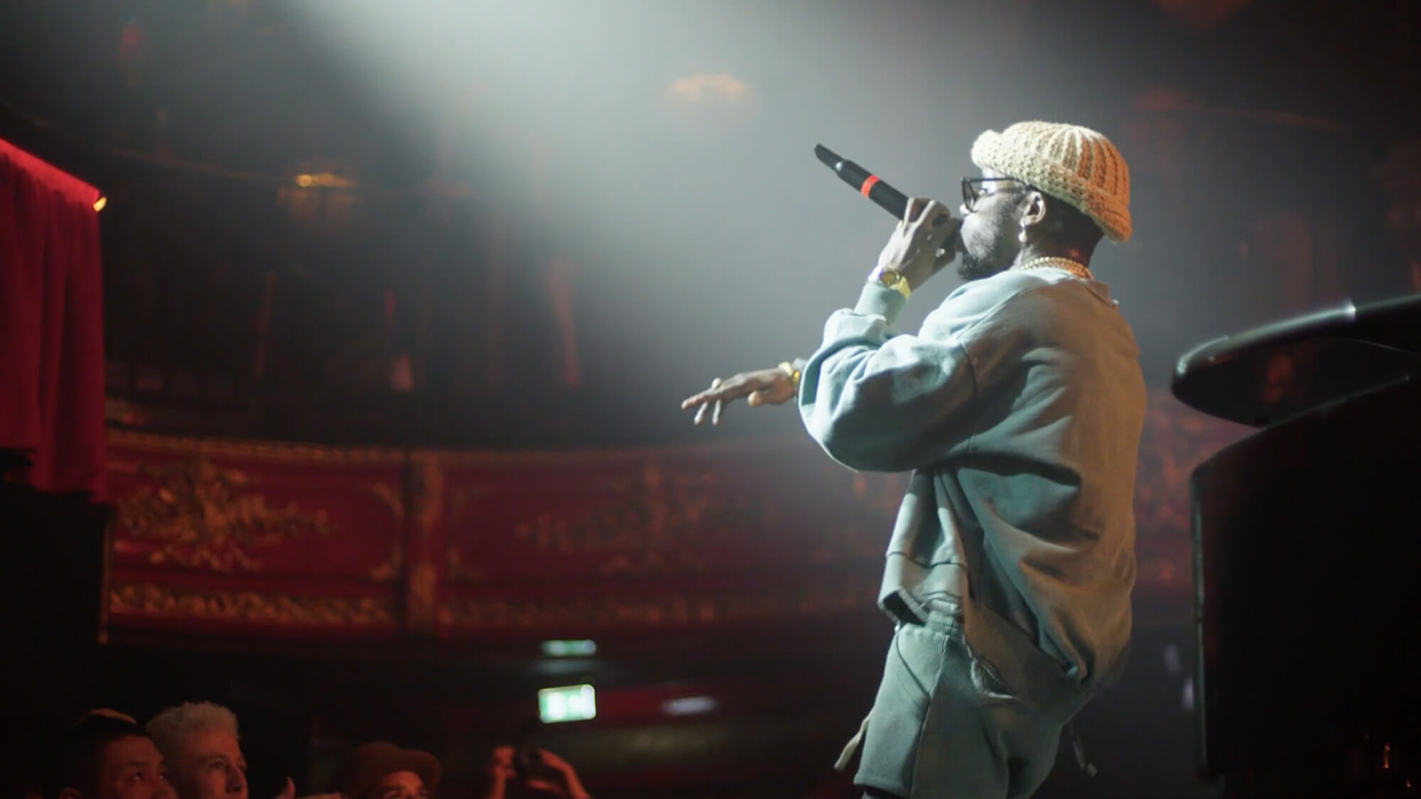 Still image of a singer on stage at an Audemars Piguet event, filmed by Rise Media