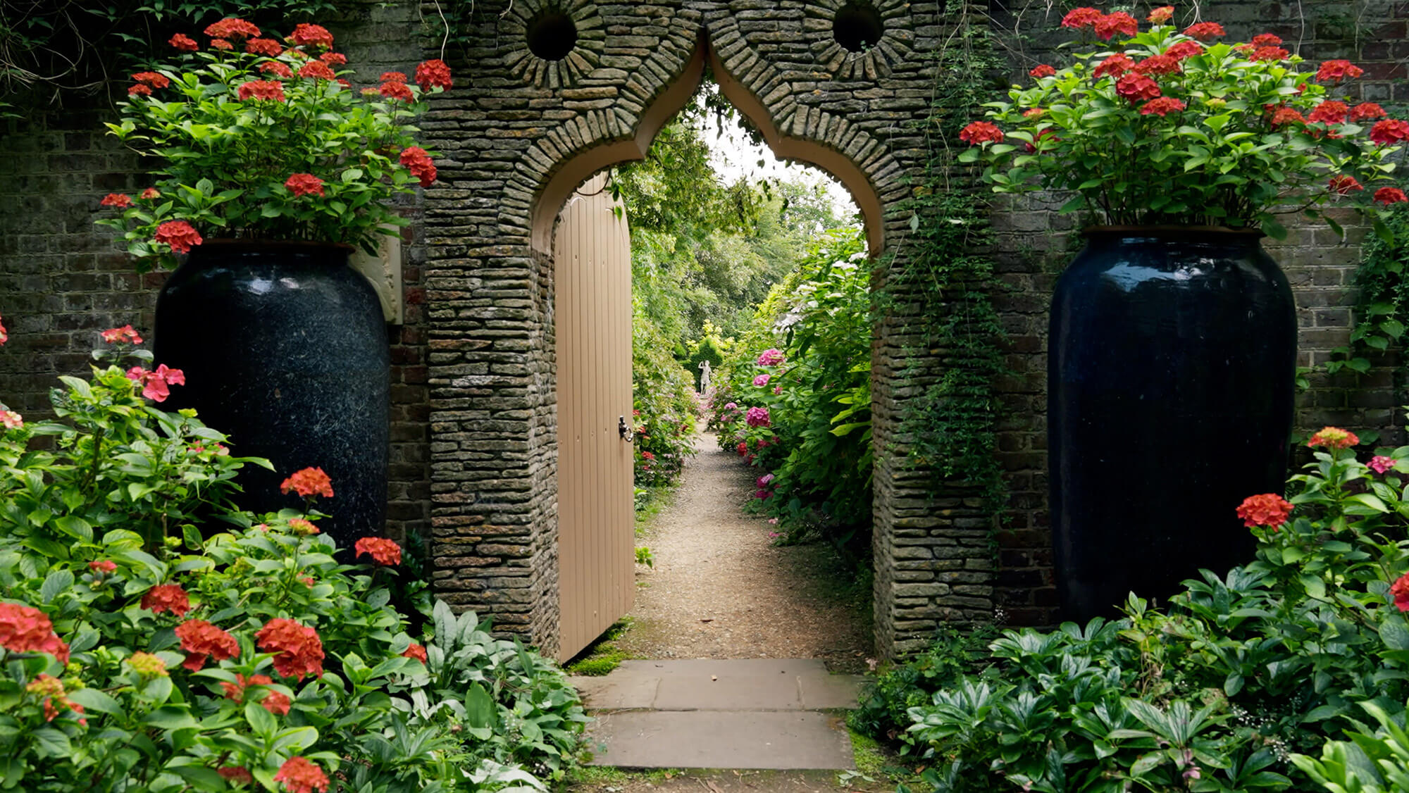 Still image of a garden entrance from a Chanel film by Rise Media.