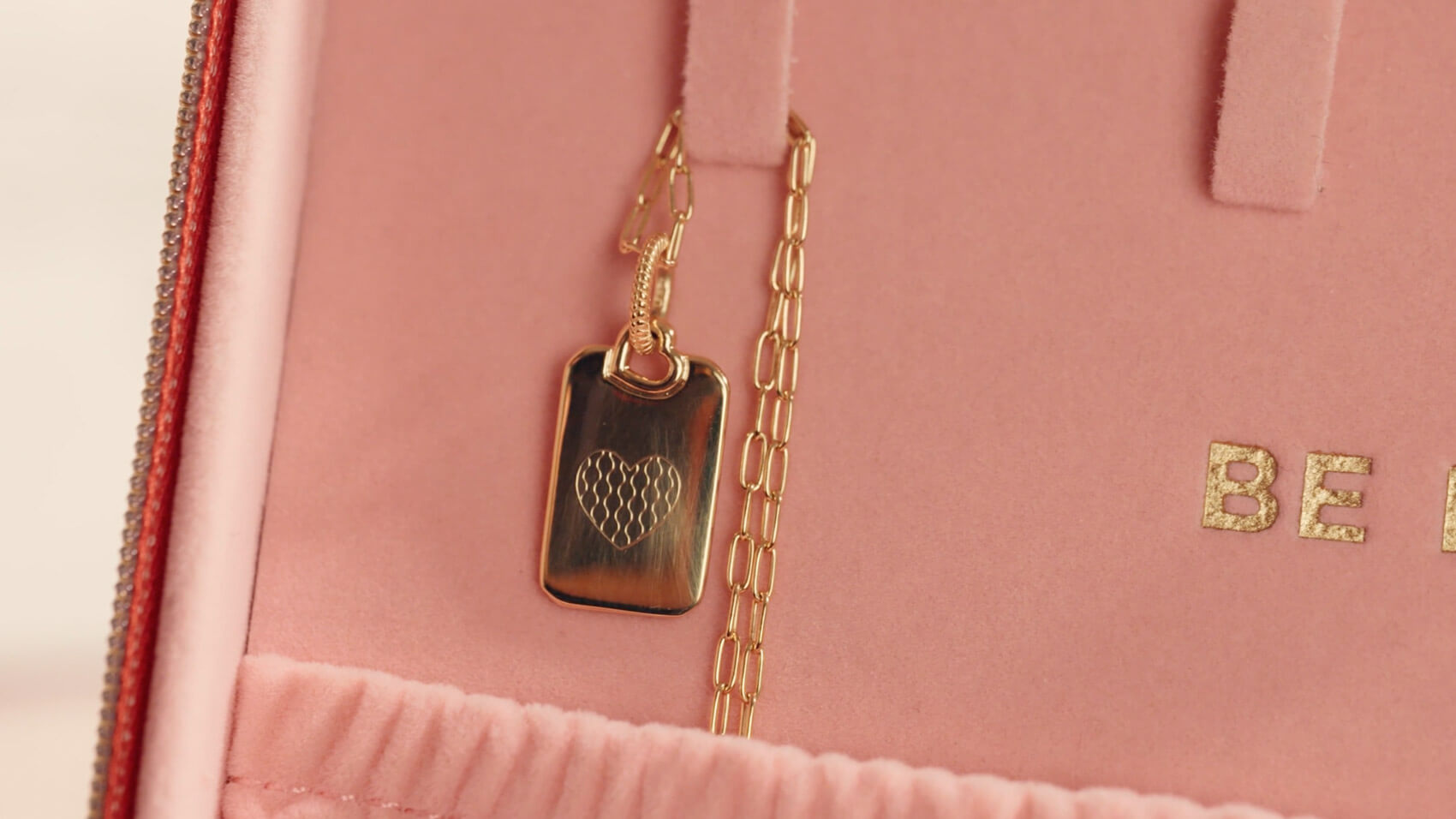 An engraved Pandora necklace in a pink box