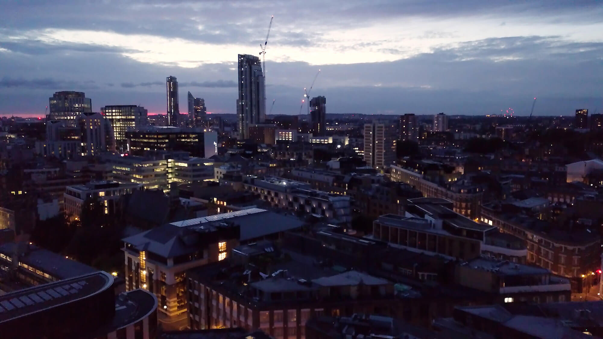 Drone shot of a city at dusk in a video for Cosmo x Lancôme's Big Summer Party, from the Rise Media case studies archive